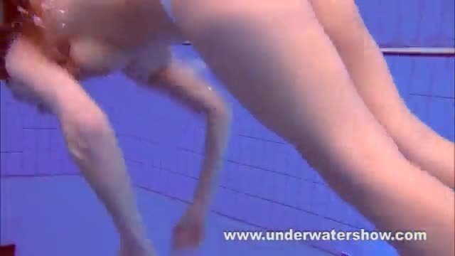 Redhead Katka playing underwater