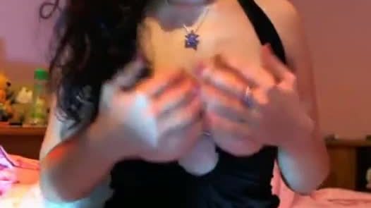 Brunette girl shows her tits in her room
