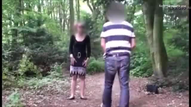 Man stalks a woman in a park
